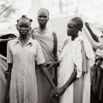Fazal Sheikh, Akuot Nyibol (pregnant at center) with Riak Warabek and Akuot’s daughter, Athok Duom, who is recovering from malaria, Sudanese refugee camp, Lokichoggio, Kenya, 1992, Yale University Art Gallery